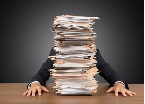 pile of invoices - invoice to purchase process challenges