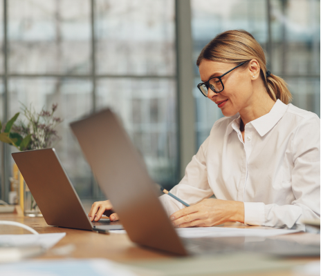 Woman on laptop migrating data from QB to Sage Intacct