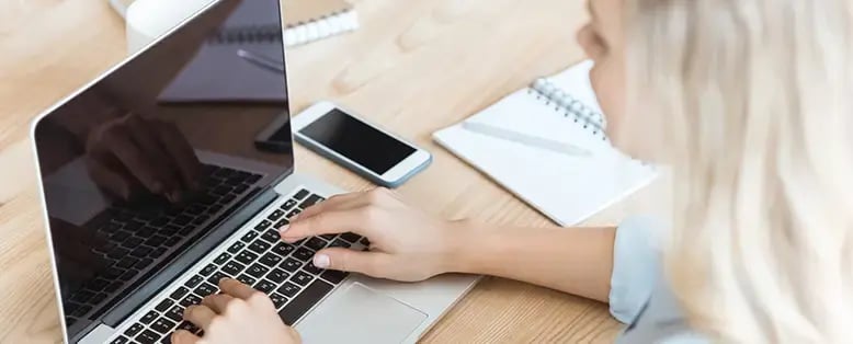 Business person on laptop testing SAP Business One Integrations