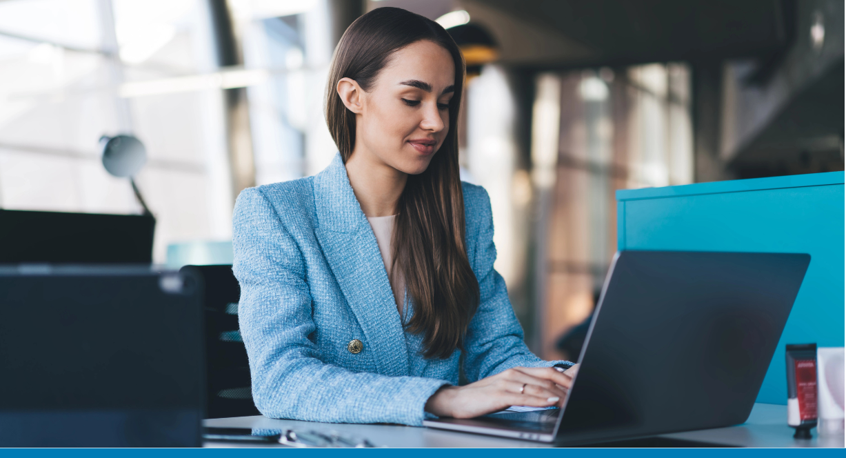 woman on computer in modern office with integration and automation