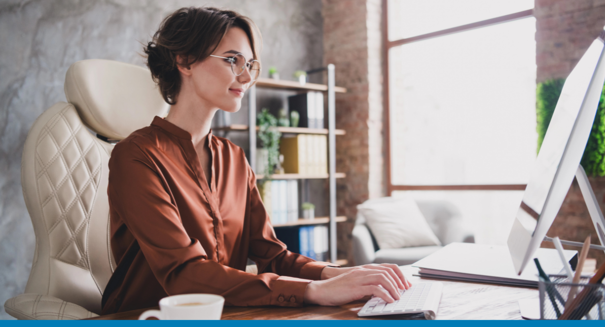 woman on computer in modern office using Copilot for SAP Business One